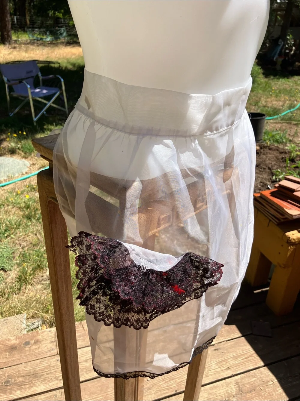 Vintage sheer apron with black and red lace pocket